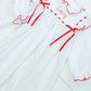 White Gown with Red Bows