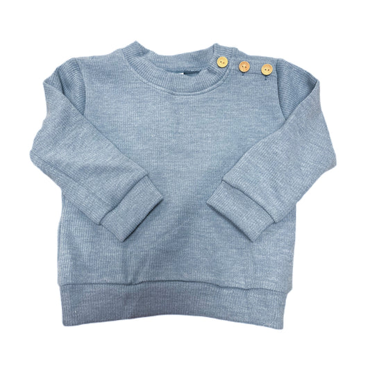 Blue sweater with wooden buttons